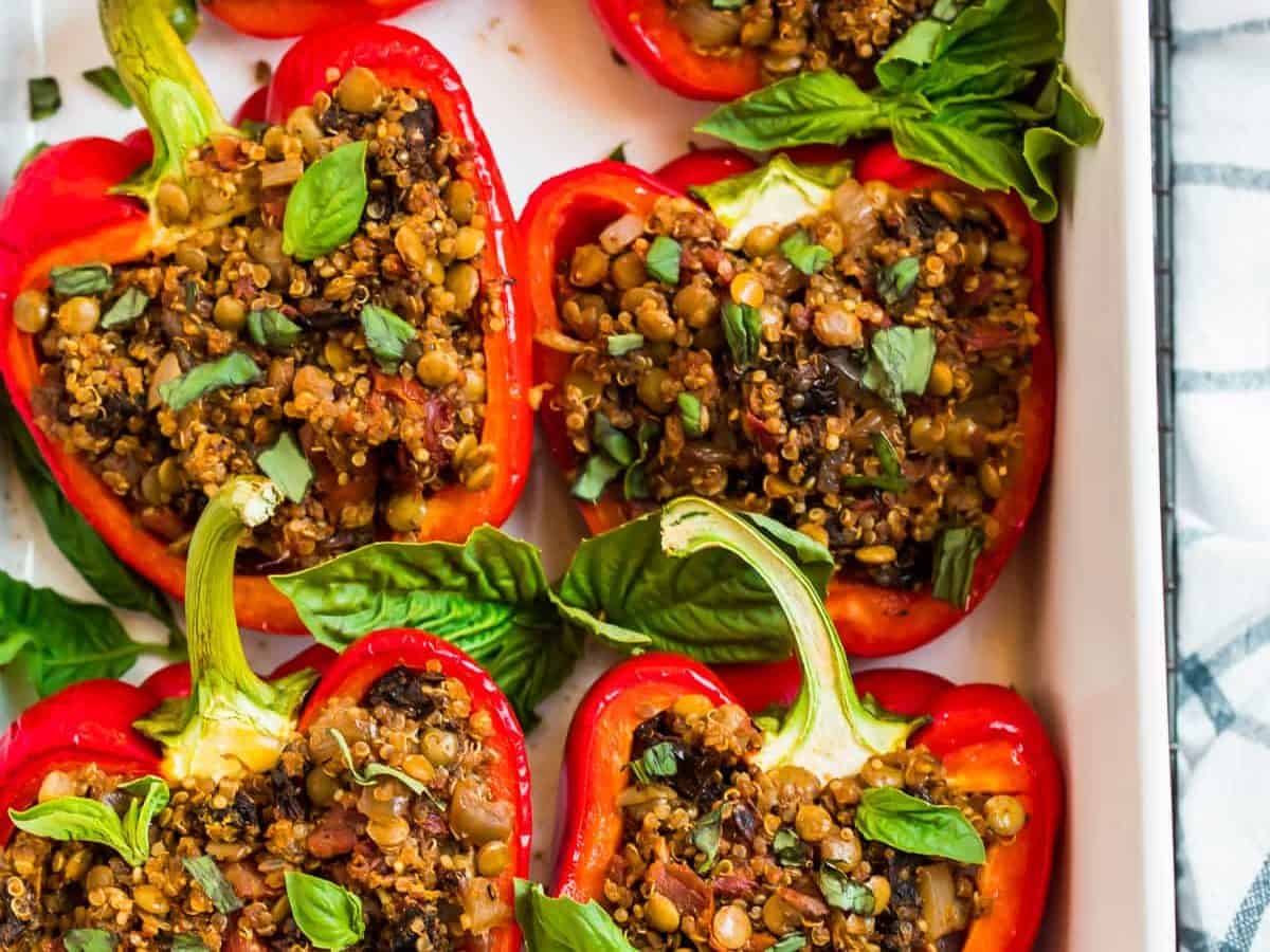 Vegan stuffed peppers in a white baking dish