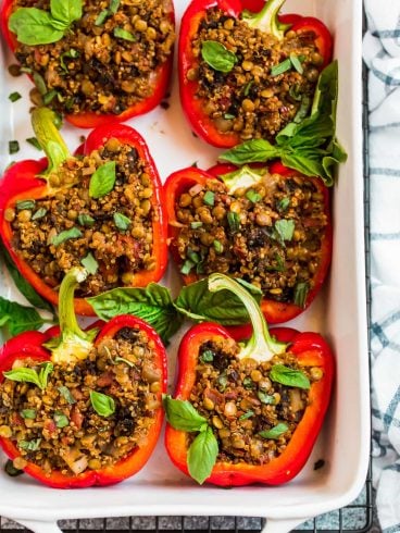 Vegan stuffed peppers in a white baking dish