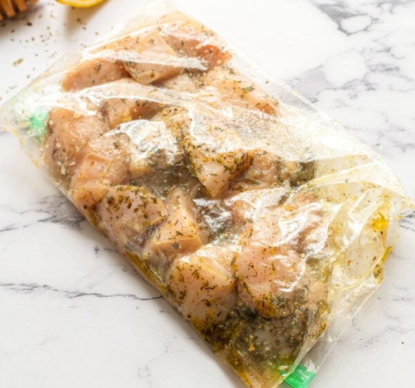 Pieces of chicken in a bag with marinade