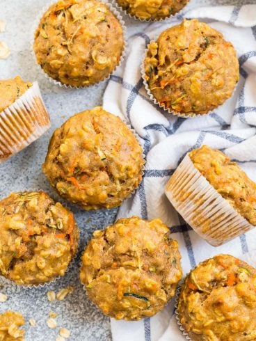 Zucchini carrot muffins on a kitchen towel