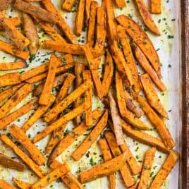 Crispy sweet potato fries on a baking sheet