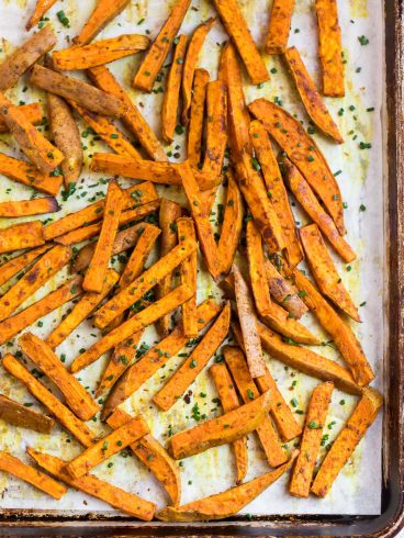 Crispy sweet potato fries on a baking sheet