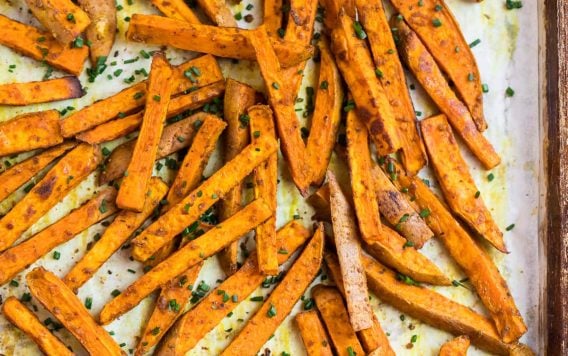Crispy sweet potato fries on a baking sheet