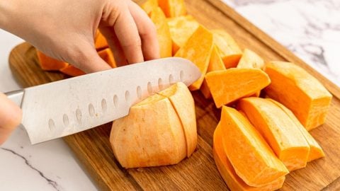 Sweet potatoes being chopped