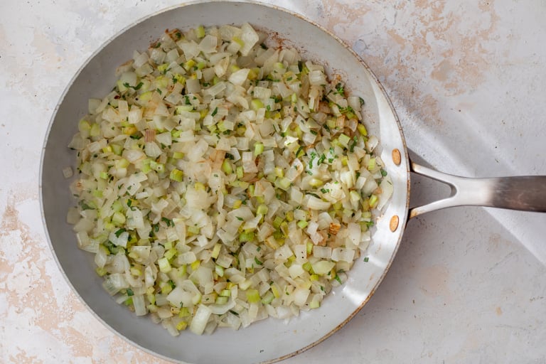 Vegetables for slow cooker stuffing in skillet