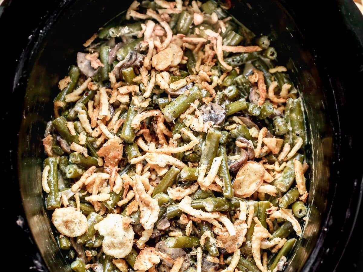 A slow cooker with vegetables