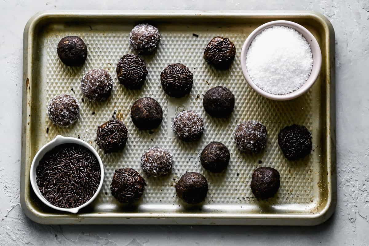 Bourbon balls on a baking sheet.