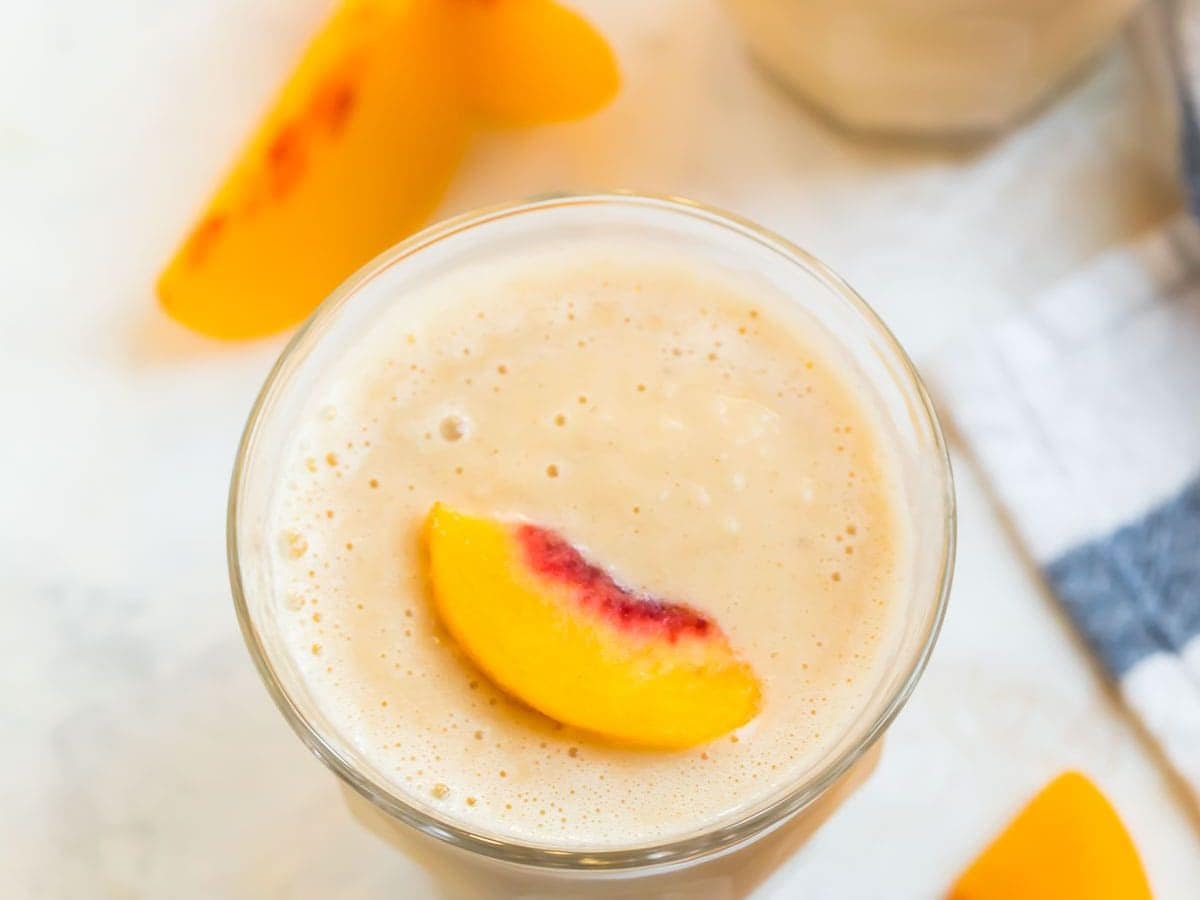 Two peach smoothies in glasses
