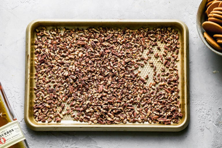 Toasted pecans on a baking sheet