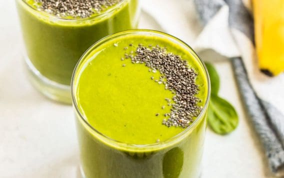 Two glasses of green smoothie with chia seeds