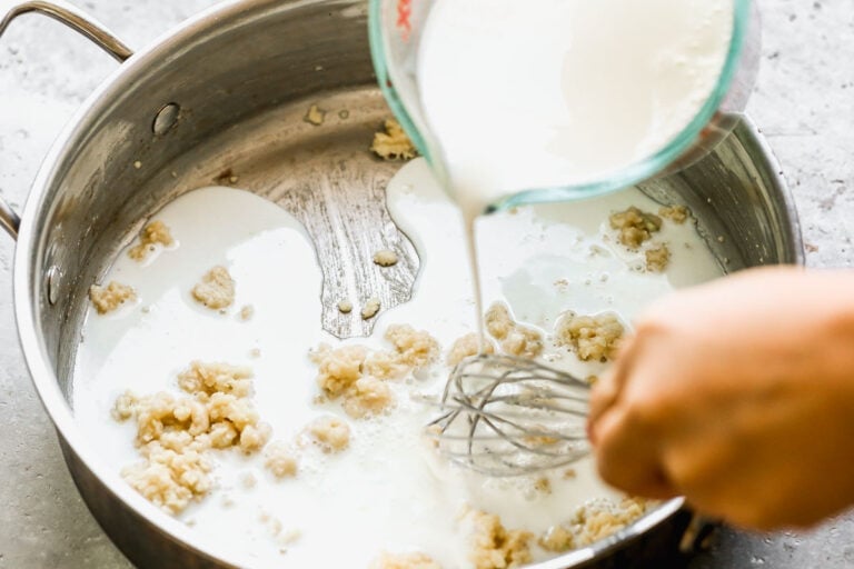 Liquid being whisked into a pot