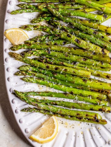 Grilled asparagus with lemon and Parmesan on a plate