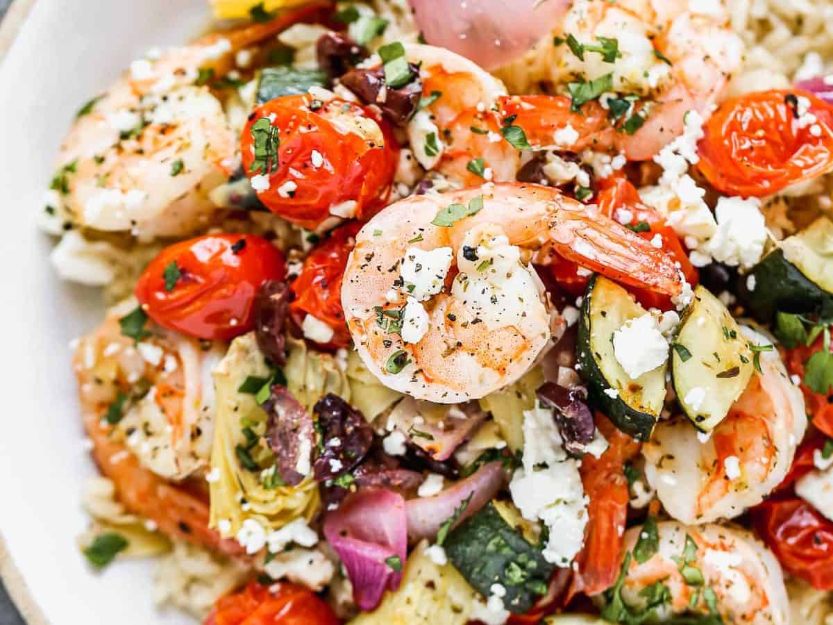 A bowl of sheet pan Mediterranean shrimp