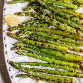 Grilled asparagus with lemon and Parmesan on a plate