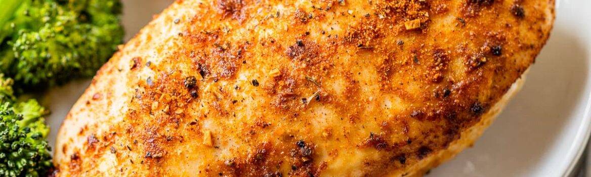 a plate with seasoned air fryer chicken breast