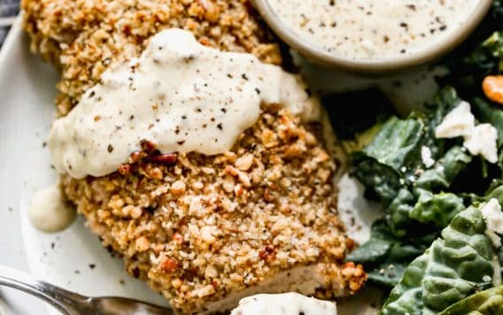 Pecan crusted chicken breast on a plate