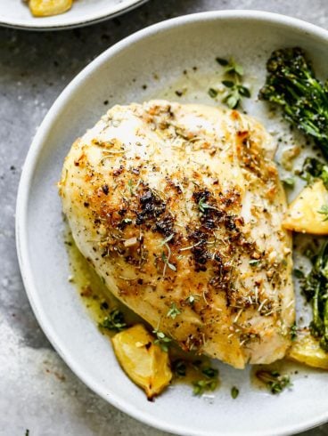 Baked bone in chicken breast on a plate