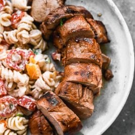grilled pork tenderloin with marinade on a plate