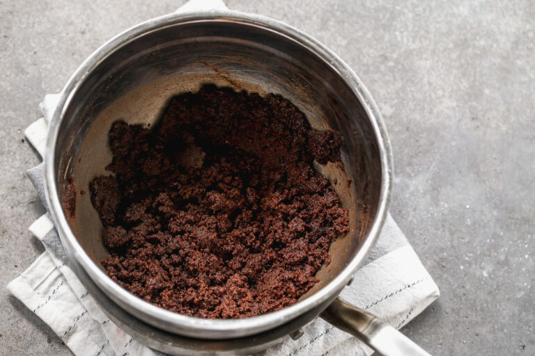 creaming cocoa and butter together with sugar for brownie batter