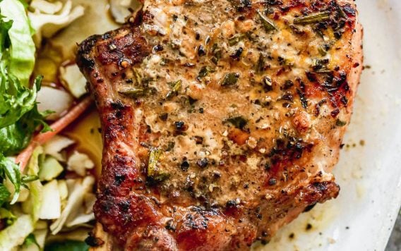 juicy grilled pork chop on a plate