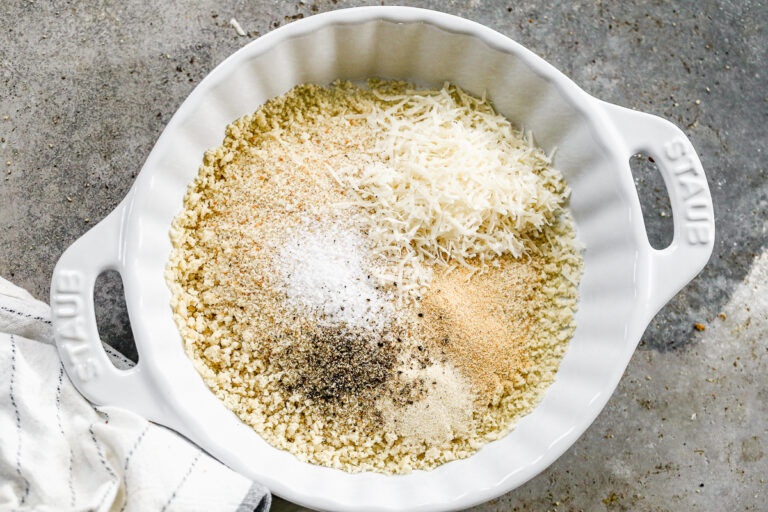 Breadcrumbs, cheese, and spices in a bowl