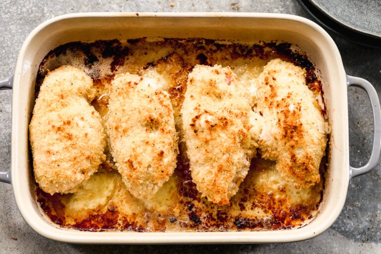 Four chicken breasts in a baking dish