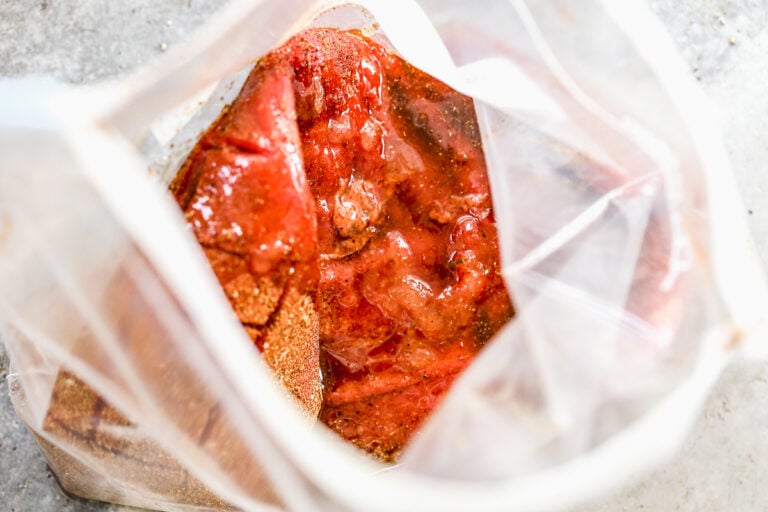 Steak marinating in a bag