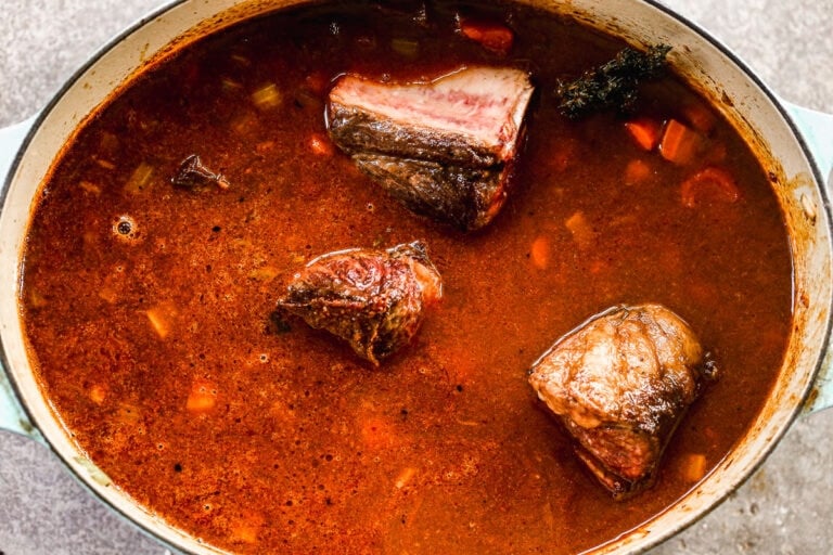 Tender red wine braised short ribs in a Dutch oven
