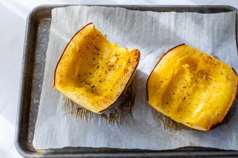 Overhead view of halved roasted spaghetti squash