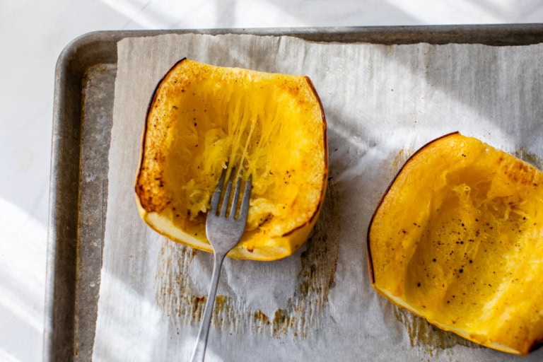 Shredding roasted spaghetti squash with fork