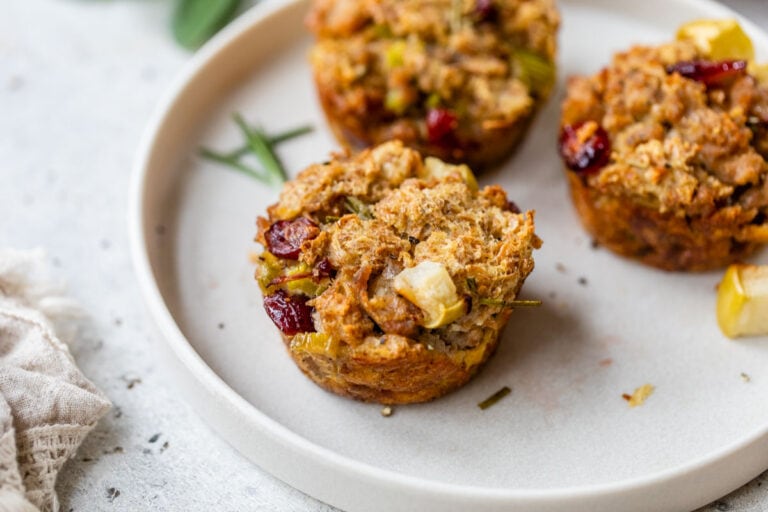 a plate with freshly baked stuffing muffins with cranberries