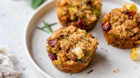 a plate with freshly baked stuffing muffins with cranberries