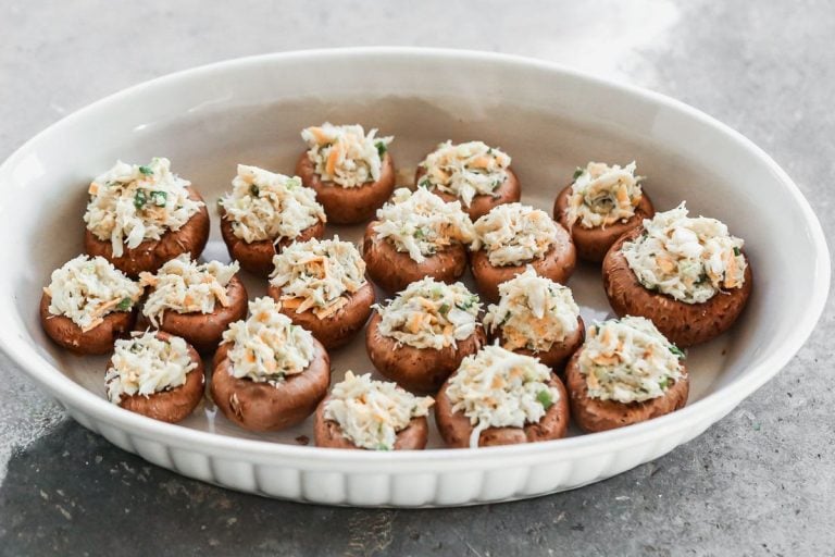 A baking dish with crab stuffed mushrooms