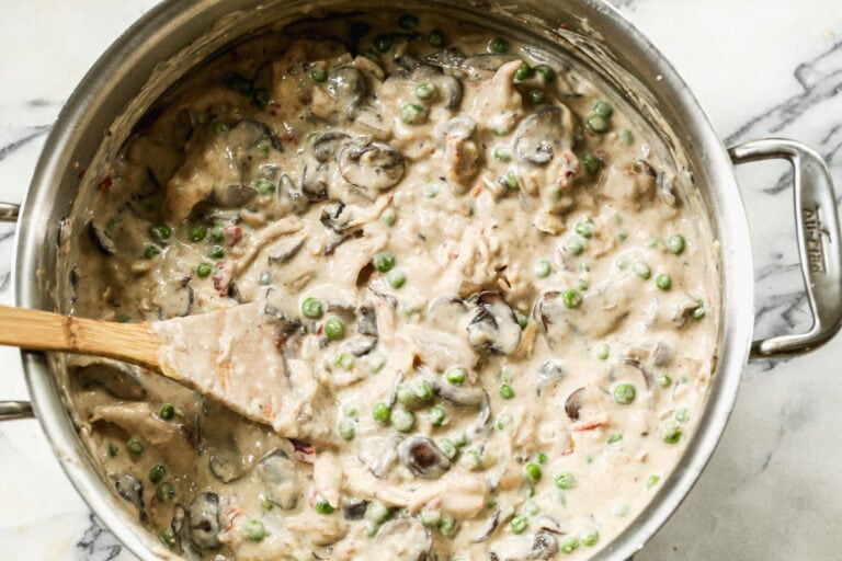 Creamy turkey tetrazzini being stirred in a pot