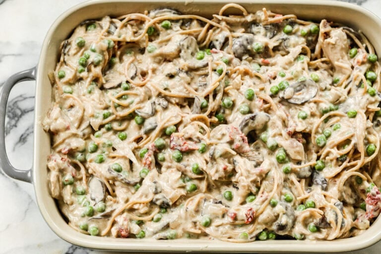 An unbaked pasta dish in a baking dish