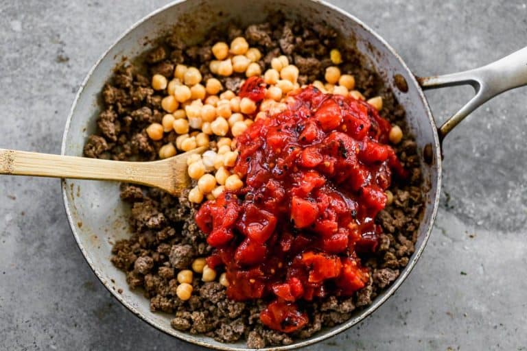 Tomatoes, chickpeas, and ground meat in a skillet
