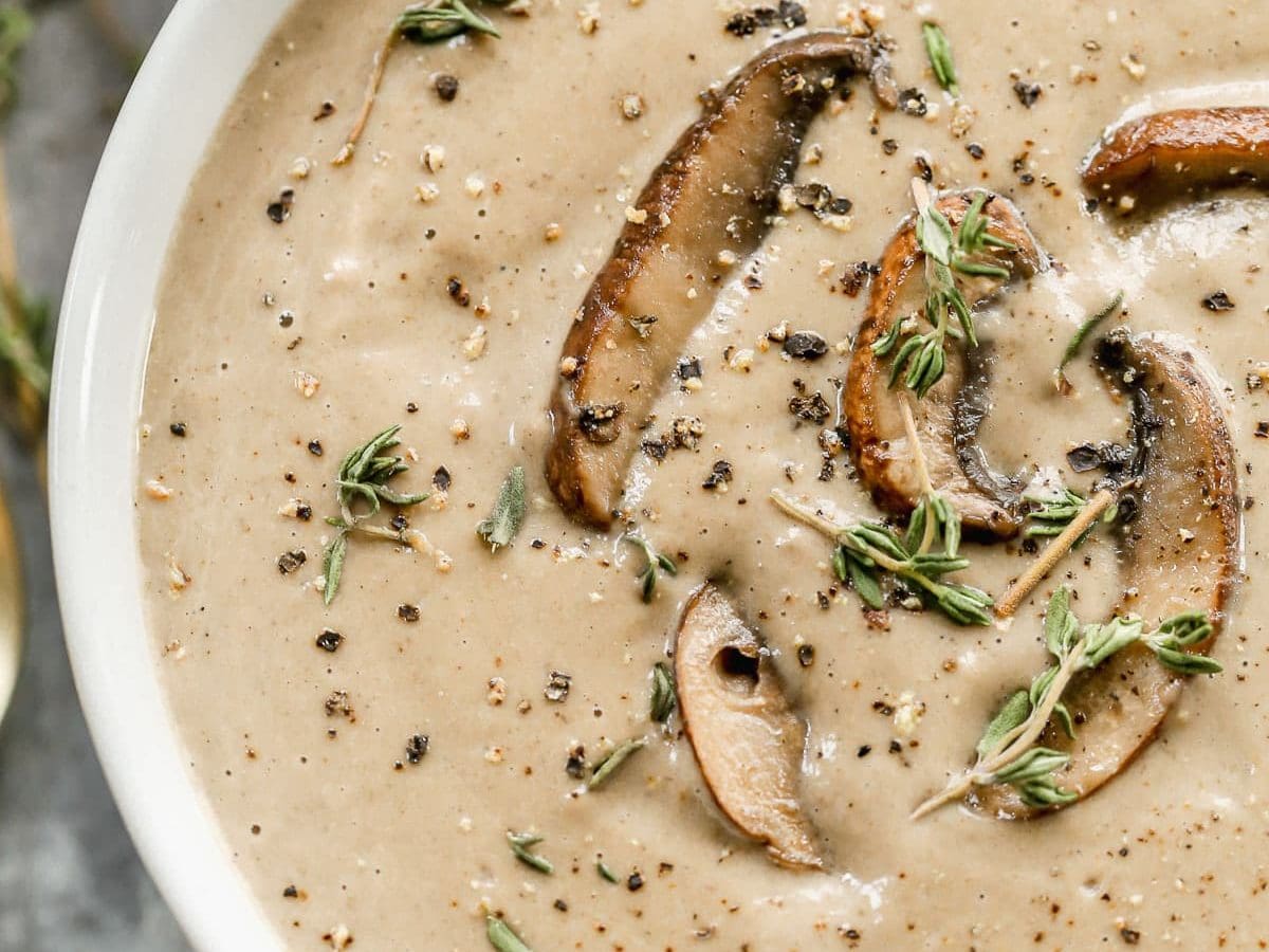 Creamy mushroom soup in a white bowl
