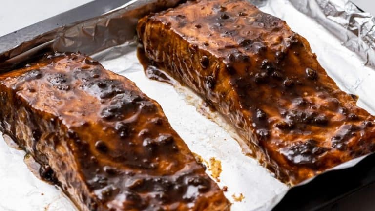 topping salmon with additional balsamic glaze before serving