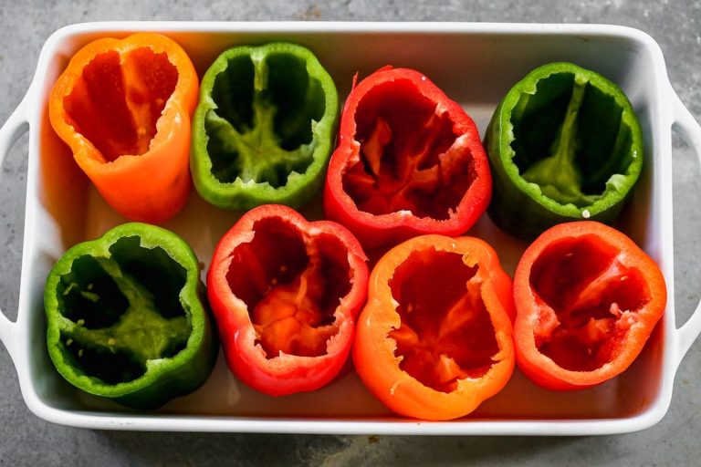Sliced bell peppers in a baking dish