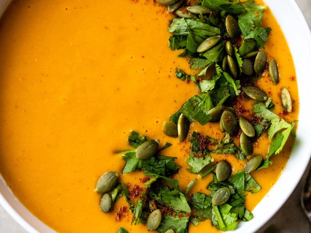 Spicy butternut squash soup with coconut milk in a white bowl