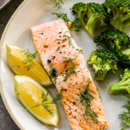 a plate with poached salmon and a side of broccoli