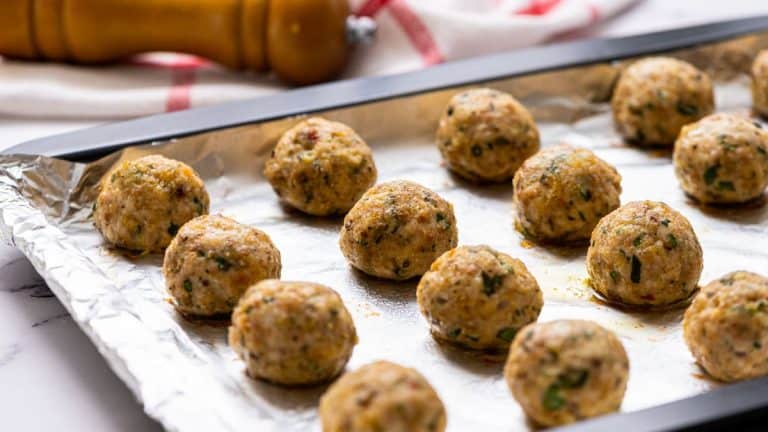 shaped turkey meatballs on a baking sheet