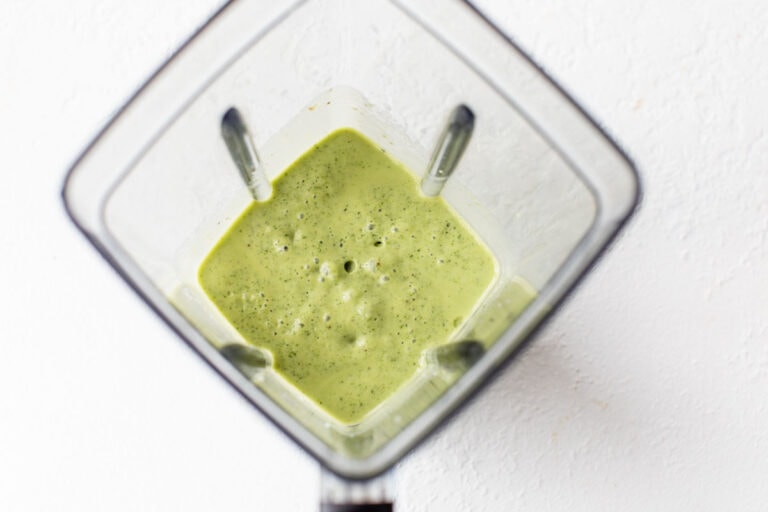 A green smoothie in a blender