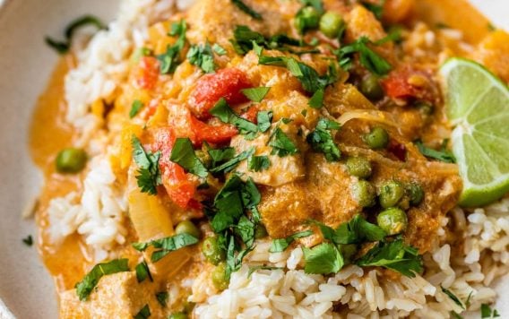 A bowl of slow cooker Thai peanut chicken with lime