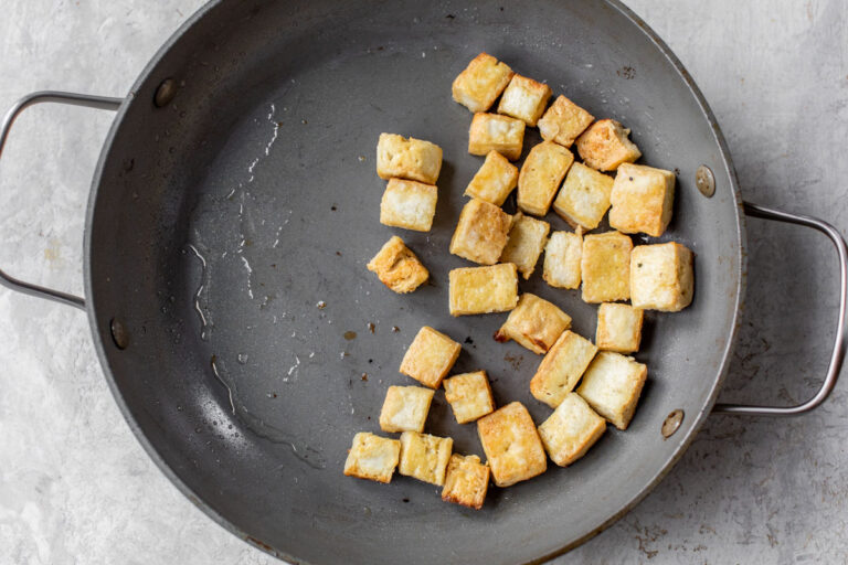 Cubes of tofu in a wok