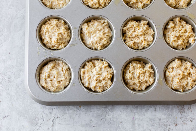 a muffin tin filled with batter for the BEST cornbread muffins