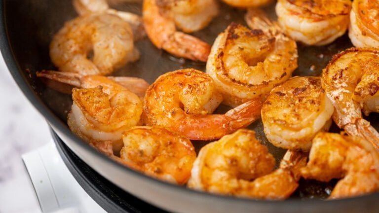 Shrimp being cooked in a skillet