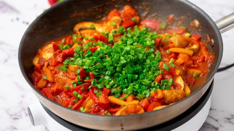 Veggies and sauce in a skillet