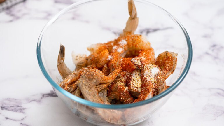 Shrimp in a bowl with seasoning