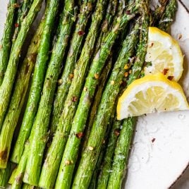air fryer asparagus spears on a white plate